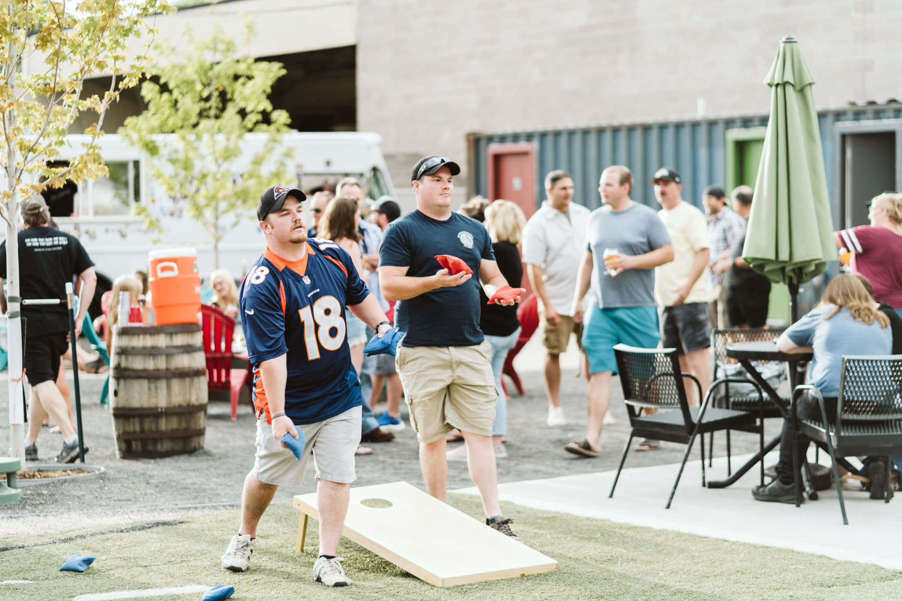 Cornhole on the turf in the yard