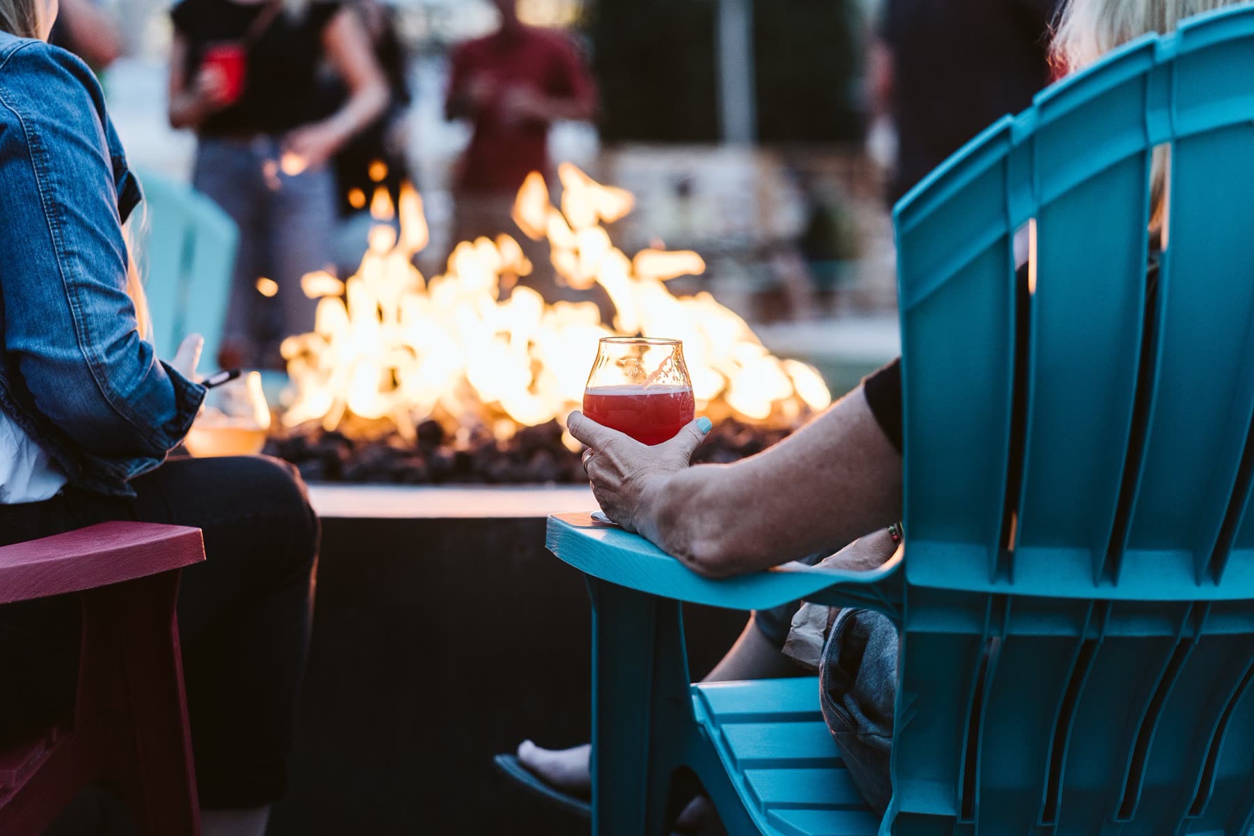 A glass of red by the fire pit