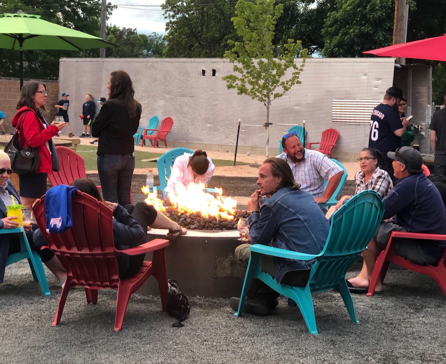 Friends around a fire pit in the yard